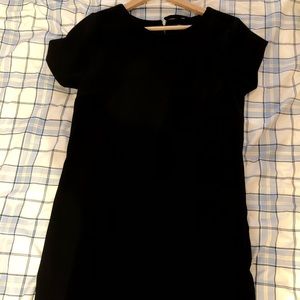 A black over the knee length dress